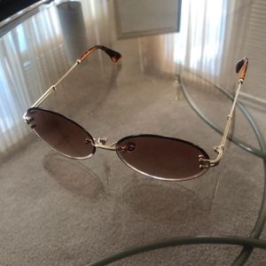 Brown lens rimless sunglasses